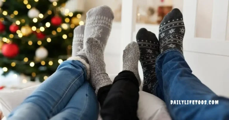 A family relaxing together, wearing cozy socks in front of a Christmas tree, highlighting the comfort and warmth of socks.